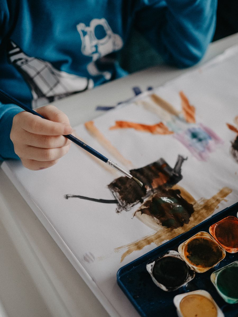 A child making a project with watercolors